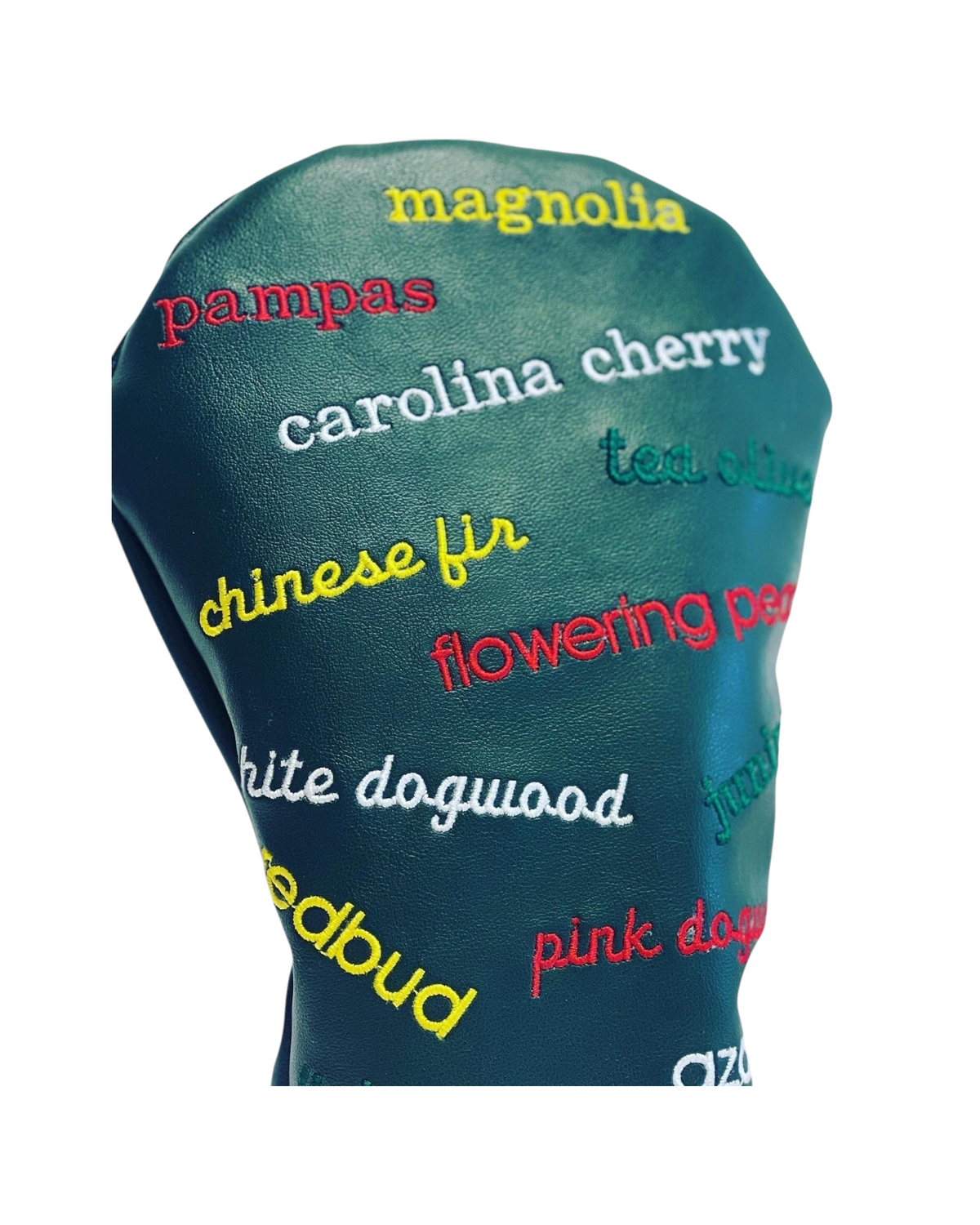 The Birdie Workshop limited edition green leather golf driver cover with colorful embroidered Masters hole names.
